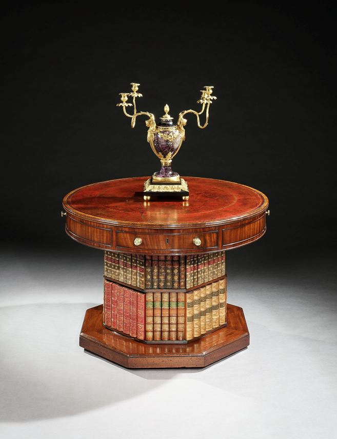 A regency mahogany revolving drum table on a bookcase pedestal | MasterArt